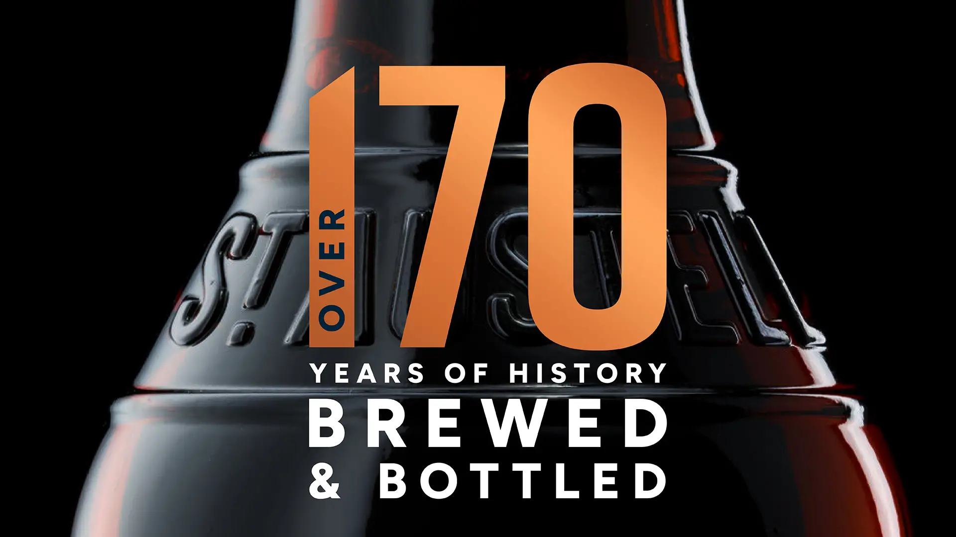 A beer bottle labeled "70 years of history brewed and bottled," showcasing its heritage and craftsmanship.