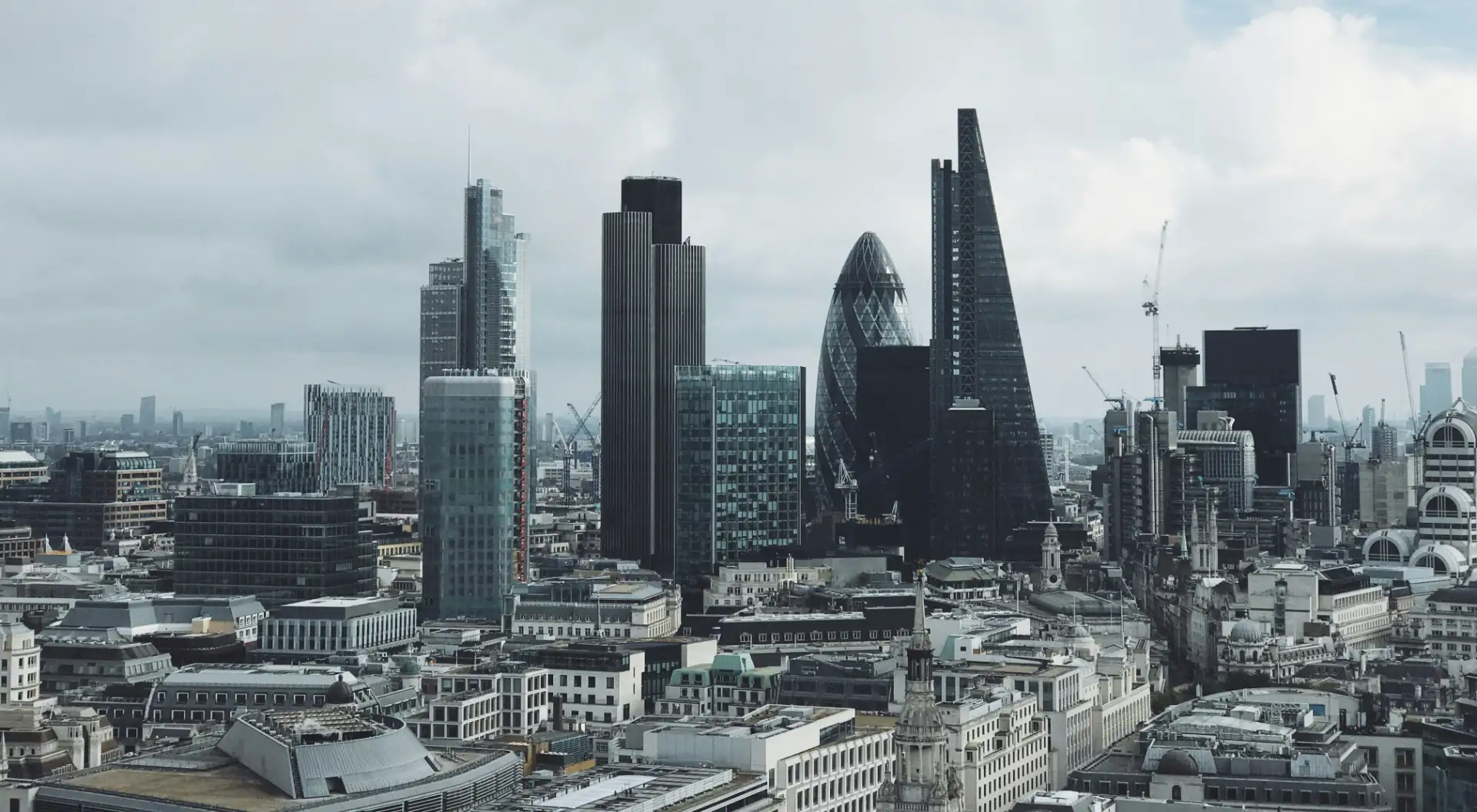 A panoramic view of London showcasing iconic landmarks from the top of a tall building.