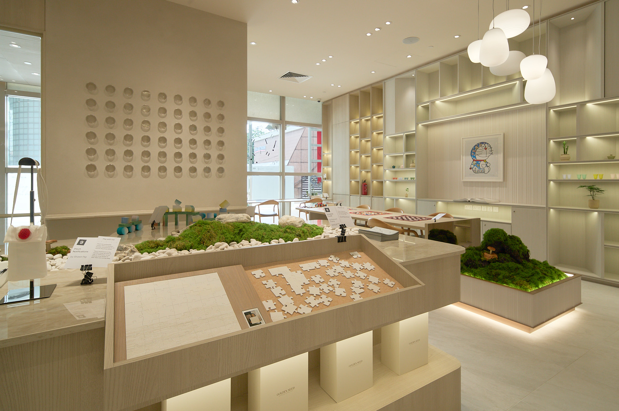 [background image] image of art supplies on a desk (for a graphic design studio)