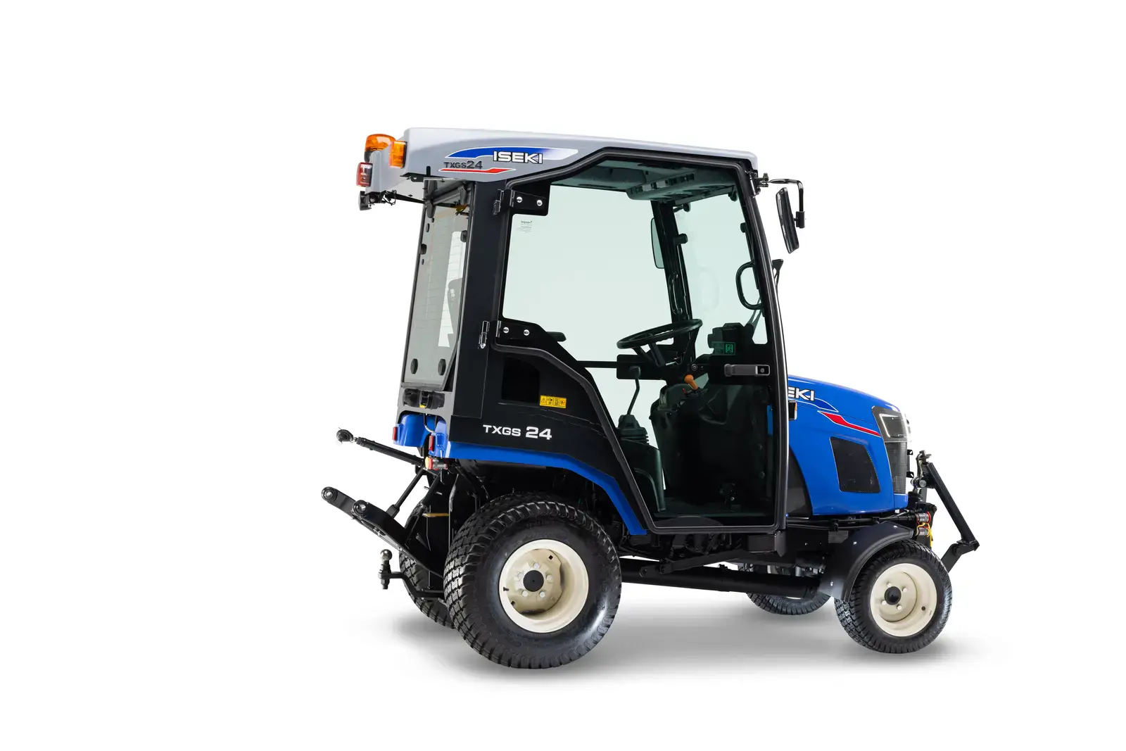 Iseki TXGS24AHLK Kompakttraktor, blaue Karosserie mit Kabine und gelber Warnleuchte auf dem Dach, von hinten gesehen.
