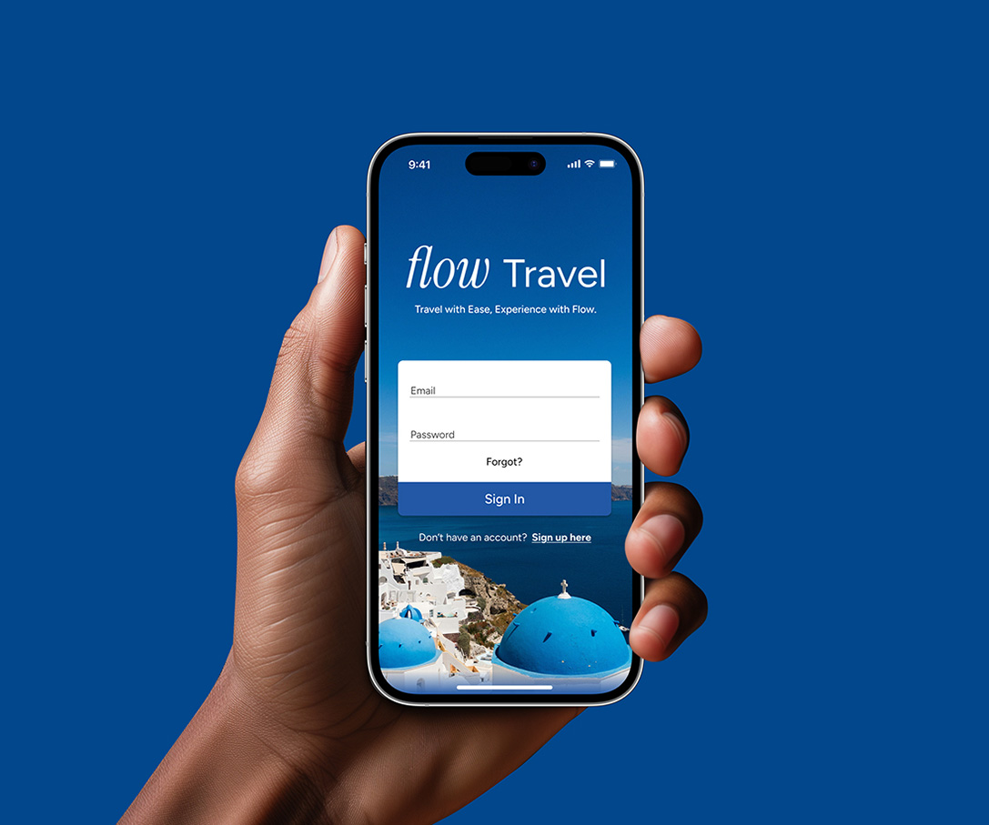 Hand holding a smartphone displaying the Flow Travel app login screen.