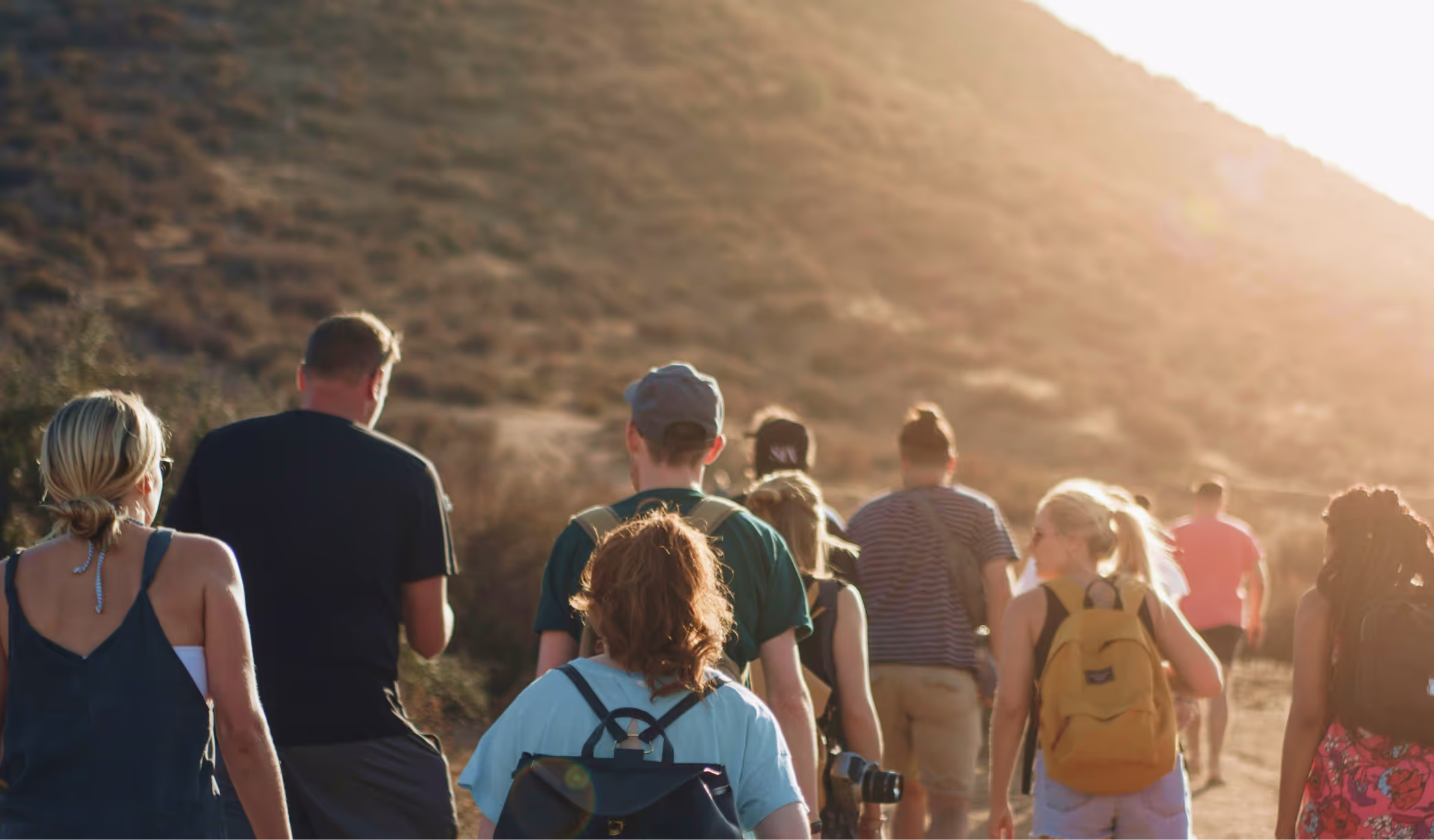 A group of people walking on a road