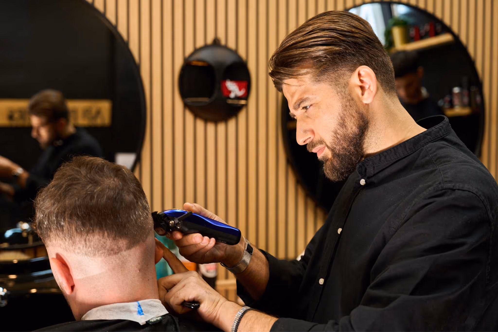 Man getting a haircut at AB Barbers Putney and Fulham.