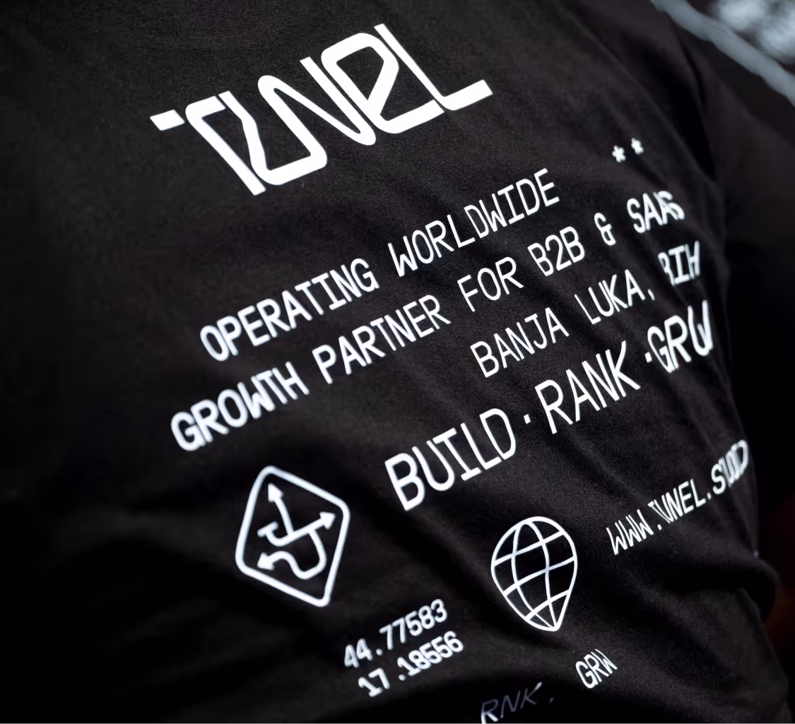 Black shirt with white text about Tunel: operating worldwide, growth partner, Banja Luka, coordinates, website.