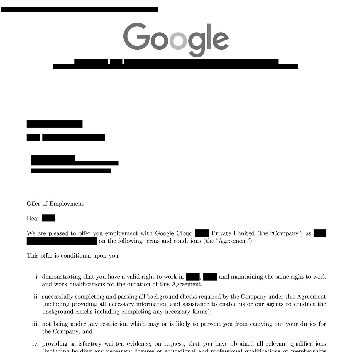 Young man with glasses and dark hair wearing a light pink shirt sitting indoors with abstract wall art in the background.