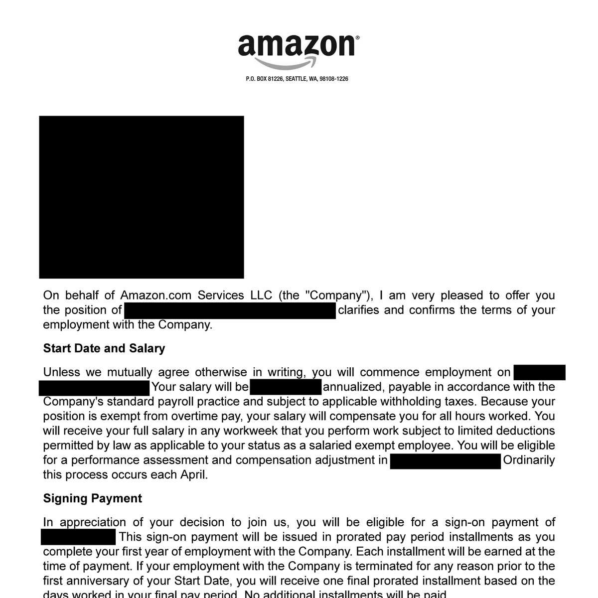 Young man with glasses and dark hair wearing a light pink shirt sitting indoors with abstract wall art in the background.