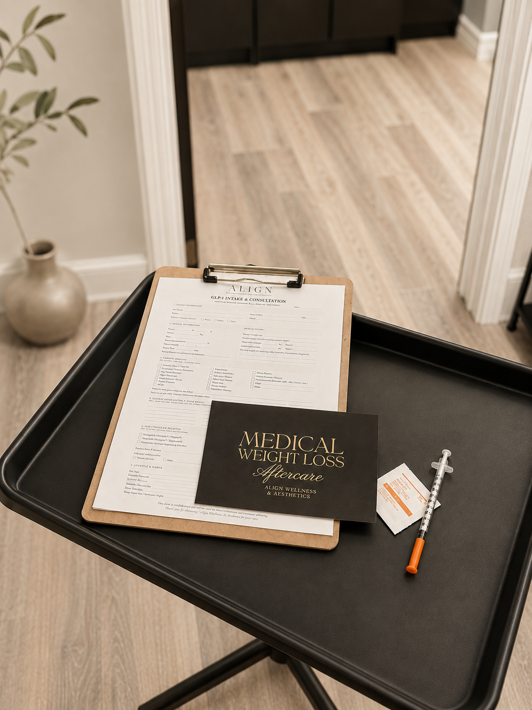 Clipboard with weight loss information and shot