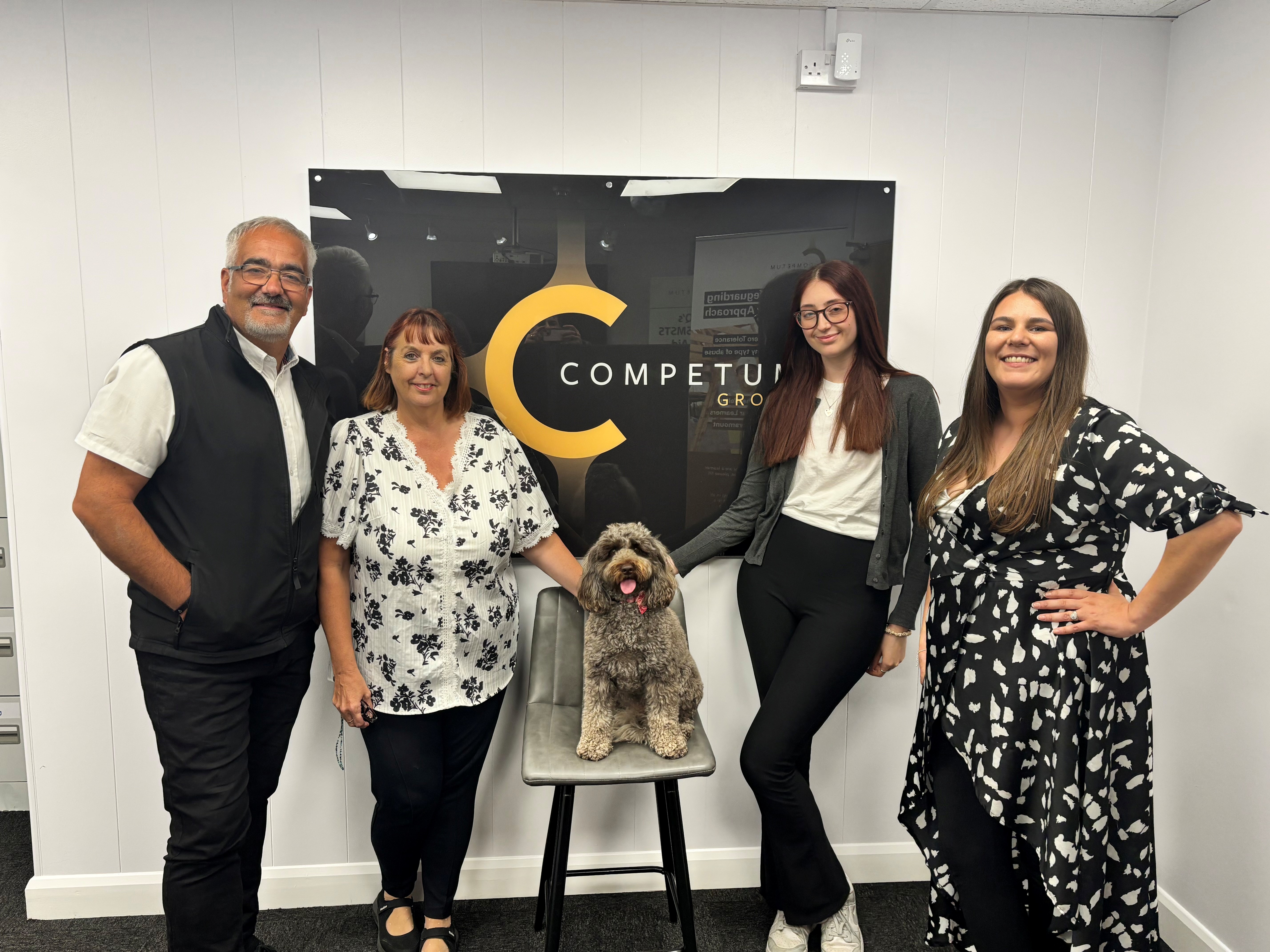 The Competum team with Lola at the Grimsby office