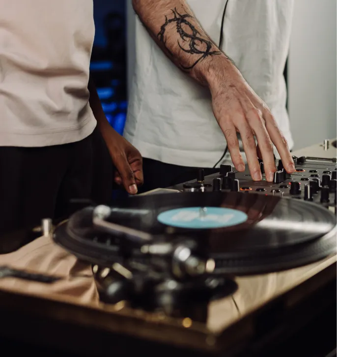 Two DJs playing back-to-back in a collaborative moment