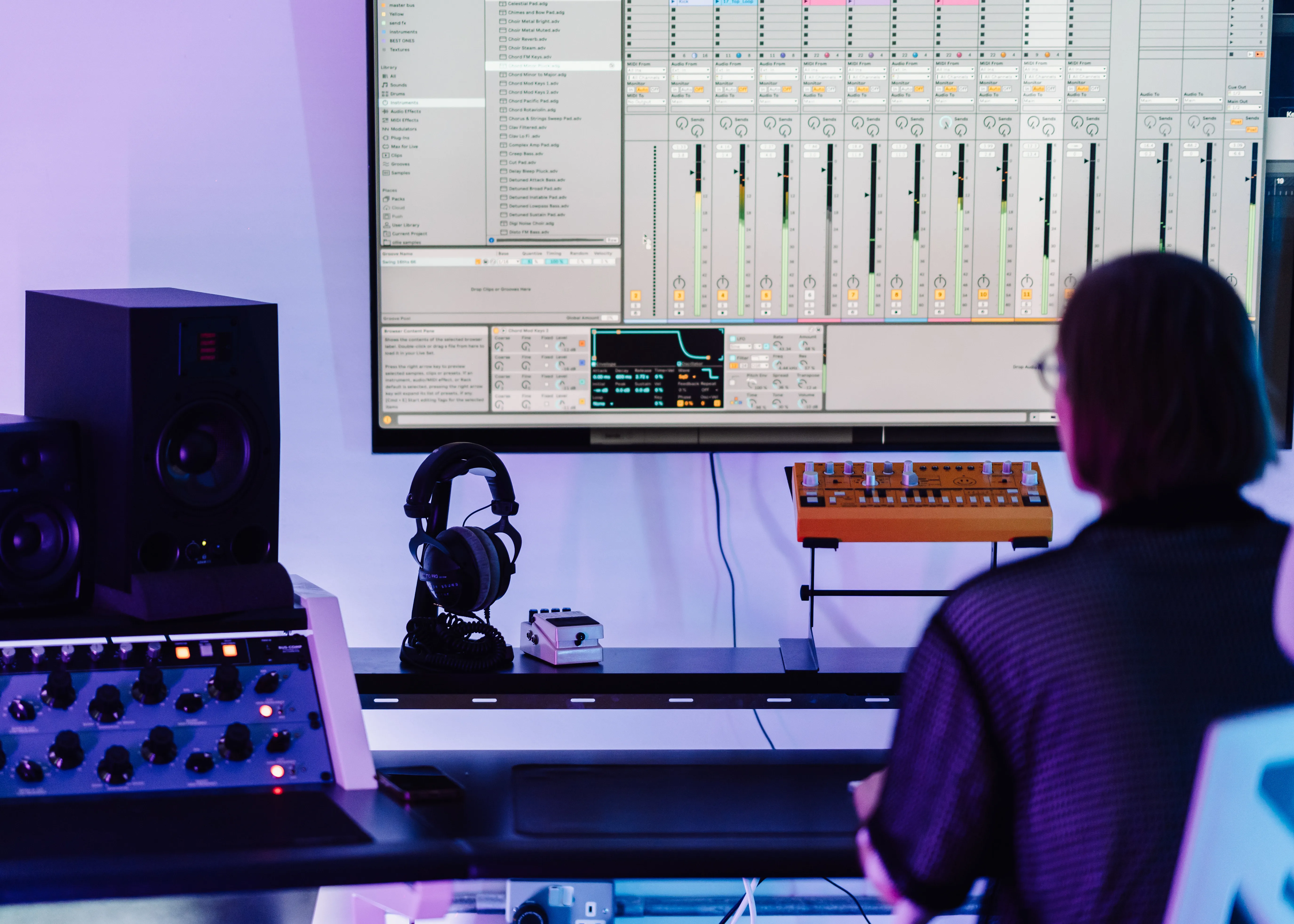 A student discussing DJ course options in London Sound Academy's reception