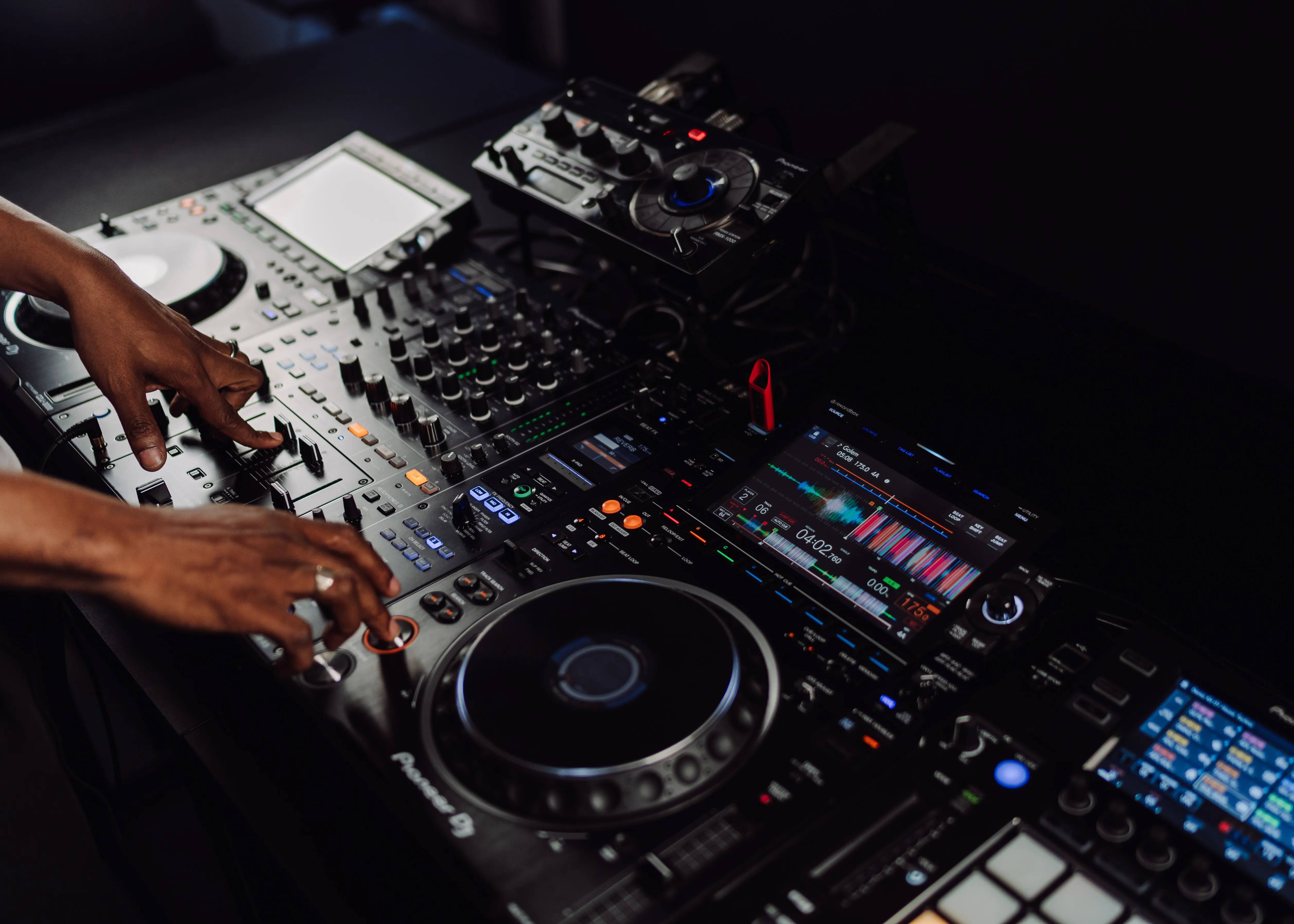 A student discussing DJ course options in London Sound Academy's reception