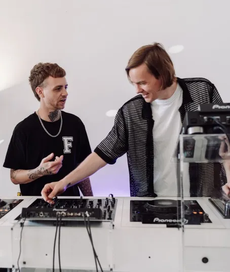 An aspiring DJ is learn how to mix on the latest DJ equipment.
