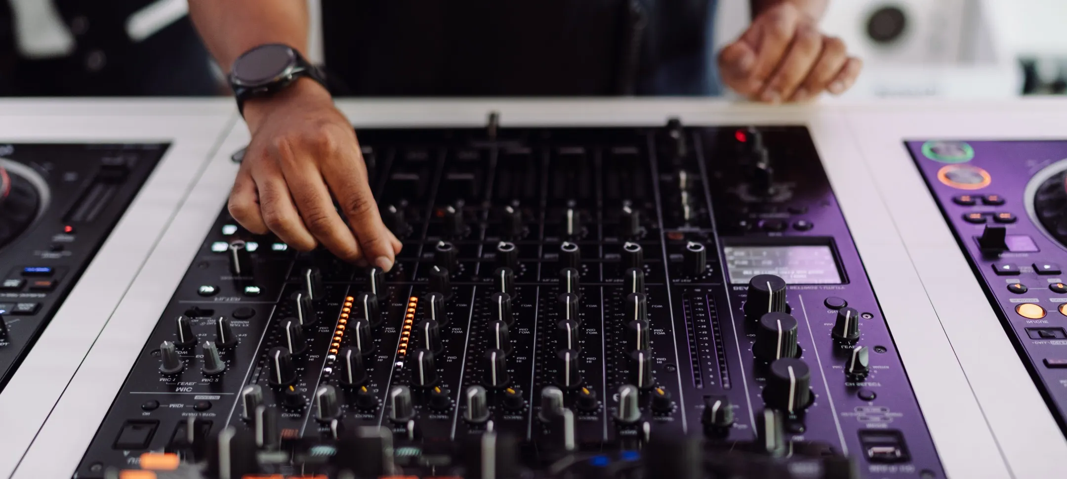 A close up image of an advanced DJ mix with the Pioneer DJMV10 mixer
