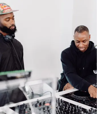 An advanced DJ course student learns how to beatmatch like a pro