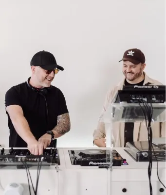 A happy elite DJ course student is surprised by the new skills he has learned.