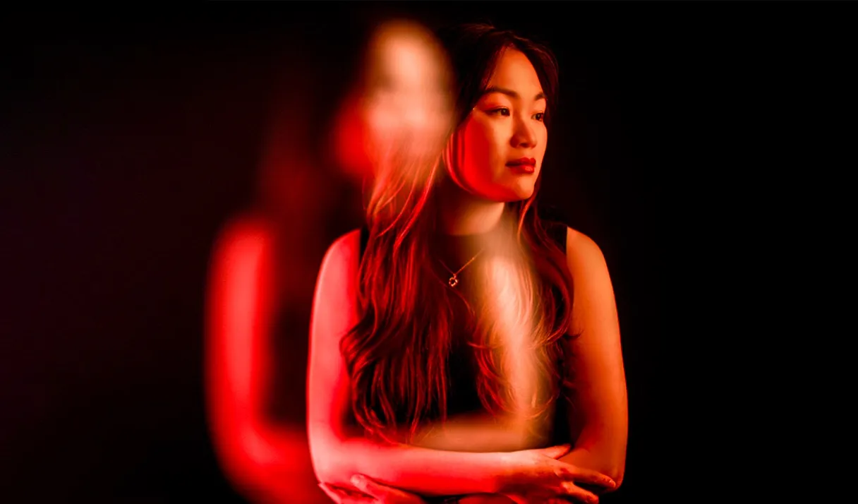 A stylised promotional photo of a female DJ showing a double vision effect
