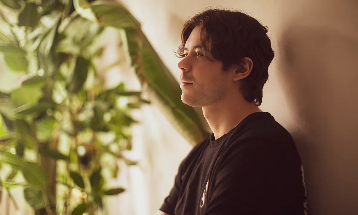 A soft light DJ portrait with a warm blue effect