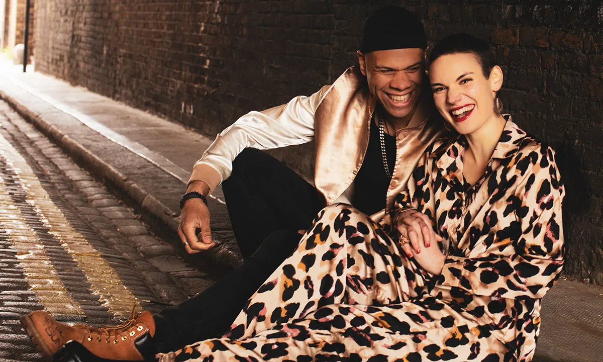 A DJ duo sat on a London street for their DJ promo photoshoot