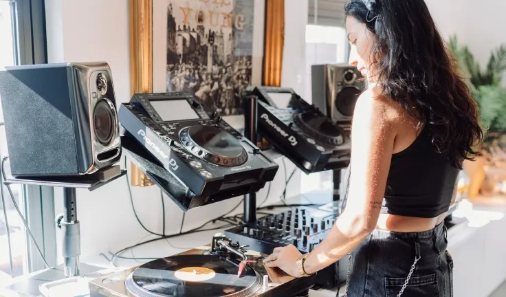 A DJ lesson taking place in a professional DJ studio in London