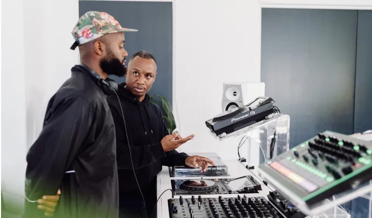 A DJ lesson taking place in a professional DJ studio in London