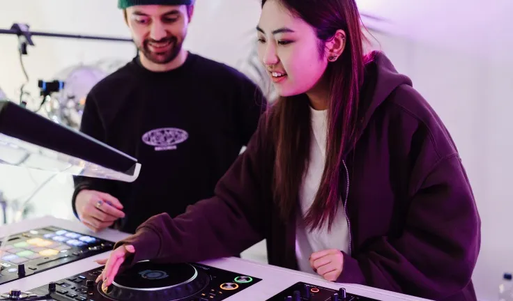 A DJ lesson taking place in a professional DJ studio in London
