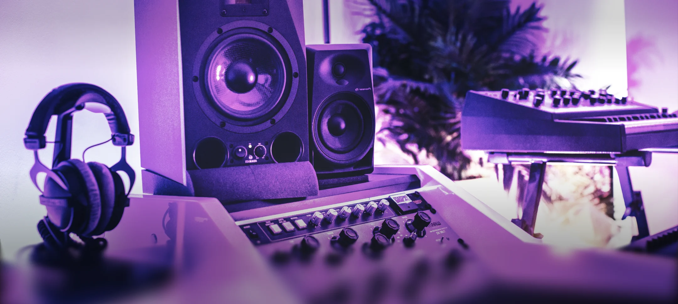 A stylish recording studio with a fully-kitted music production station