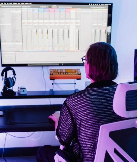 A music producer is making beats with Ableton