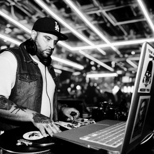 DJ tutor and turntablist Davide in action on the decks in a professional press photo for London Sound Academy.