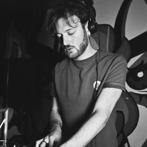 DJ and music production tutor Alberto in the mix DJing in a professional press photo for London Sound Academy.
