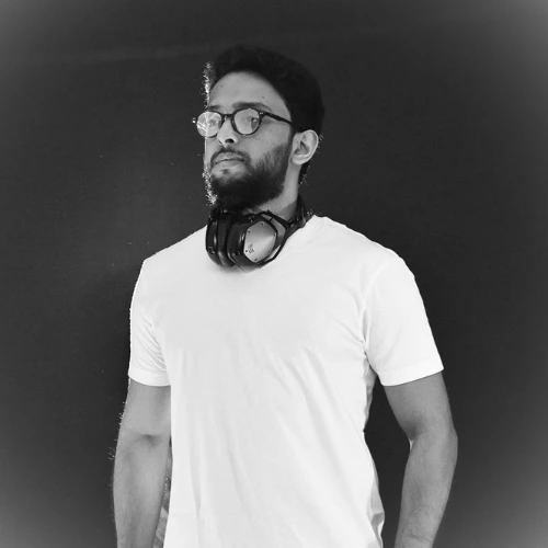 London Sound Academy music production tutor and sound engineer Ananth poses for the camera for his artist press shot.