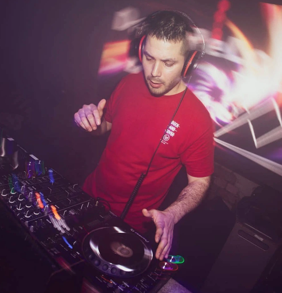 A man is DJing at club in London