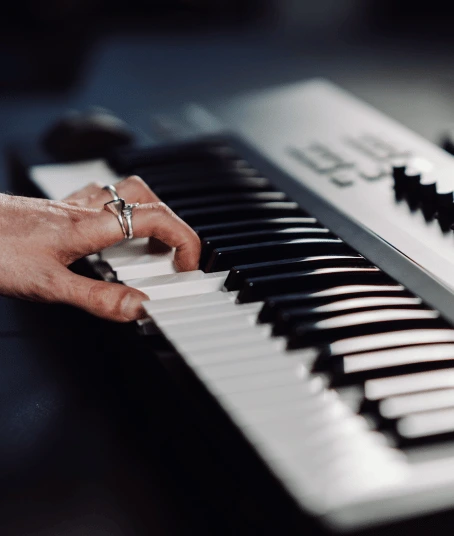 A woman plays the keyboard