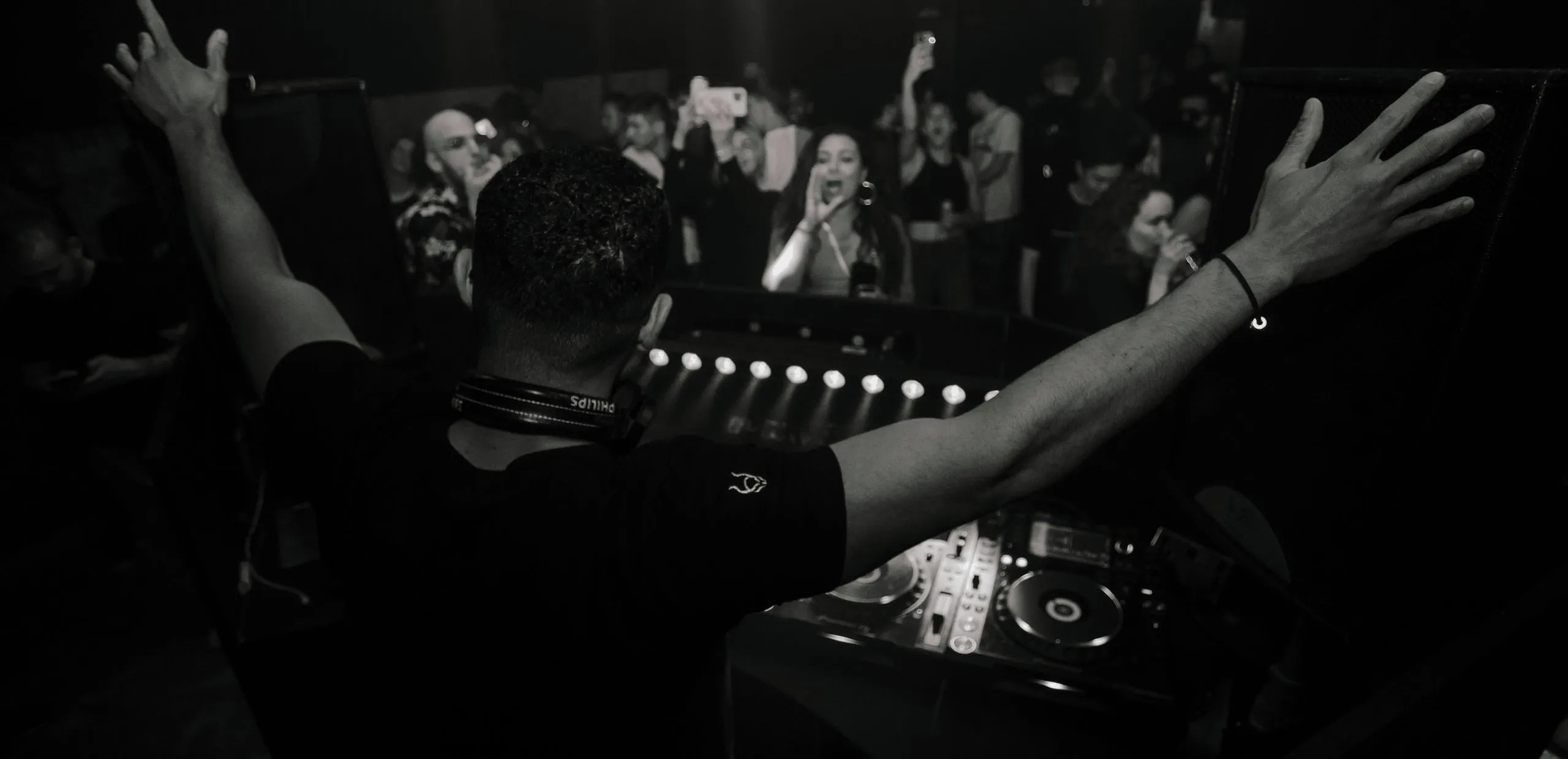 A DJ performs in a superclub