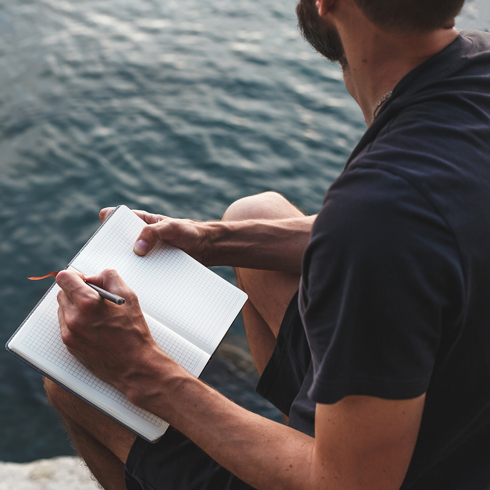 Contemplative entrepreneur journalling to create a 10-year vision.