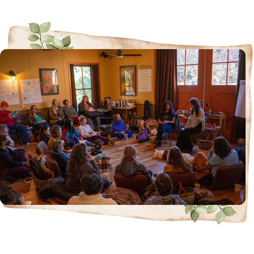 a room with people surrounding Lydia Violet