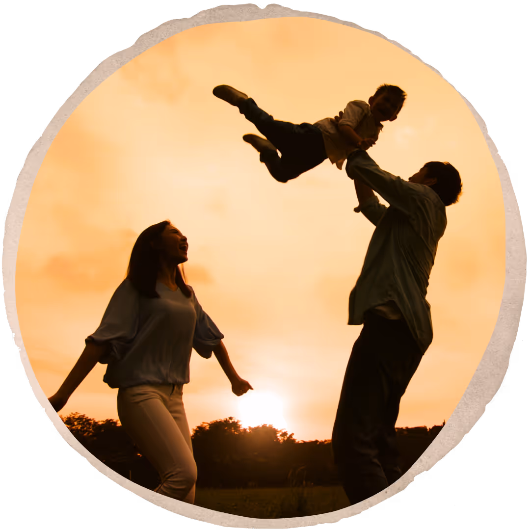 a photo of parents playing with their child