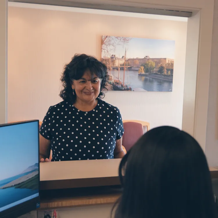 Patient checking in to Concord Heritage Dental