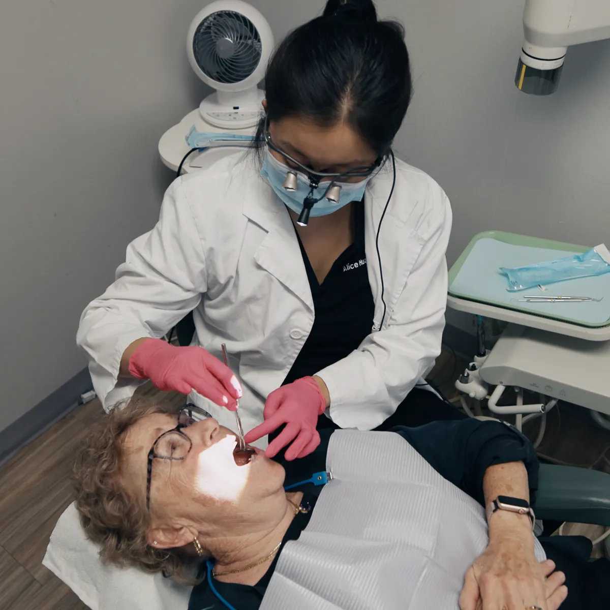 Dr. Huang treating a patient at Concord Heritage Dental