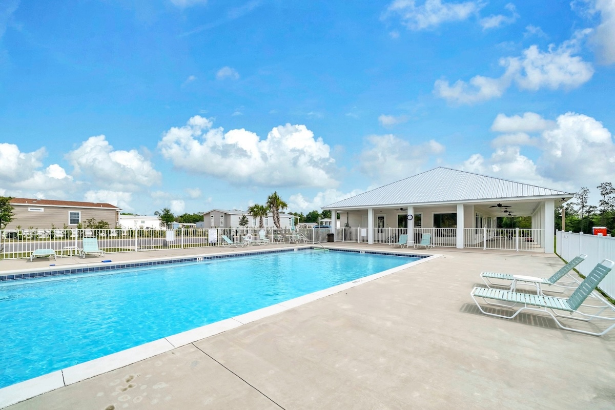 Swimming Pool and Clubhouse at Riverwalk Landing Senior Living Community