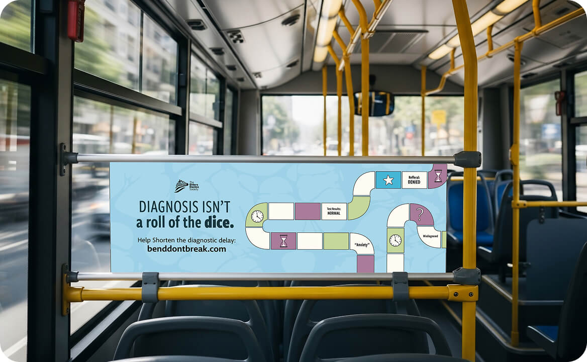 Bus interior with a blue sign displaying a board game path and text: 'Diagnosis isn't a roll of the dice. Help shorten the diagnostic delay: benddontbreak.com.'