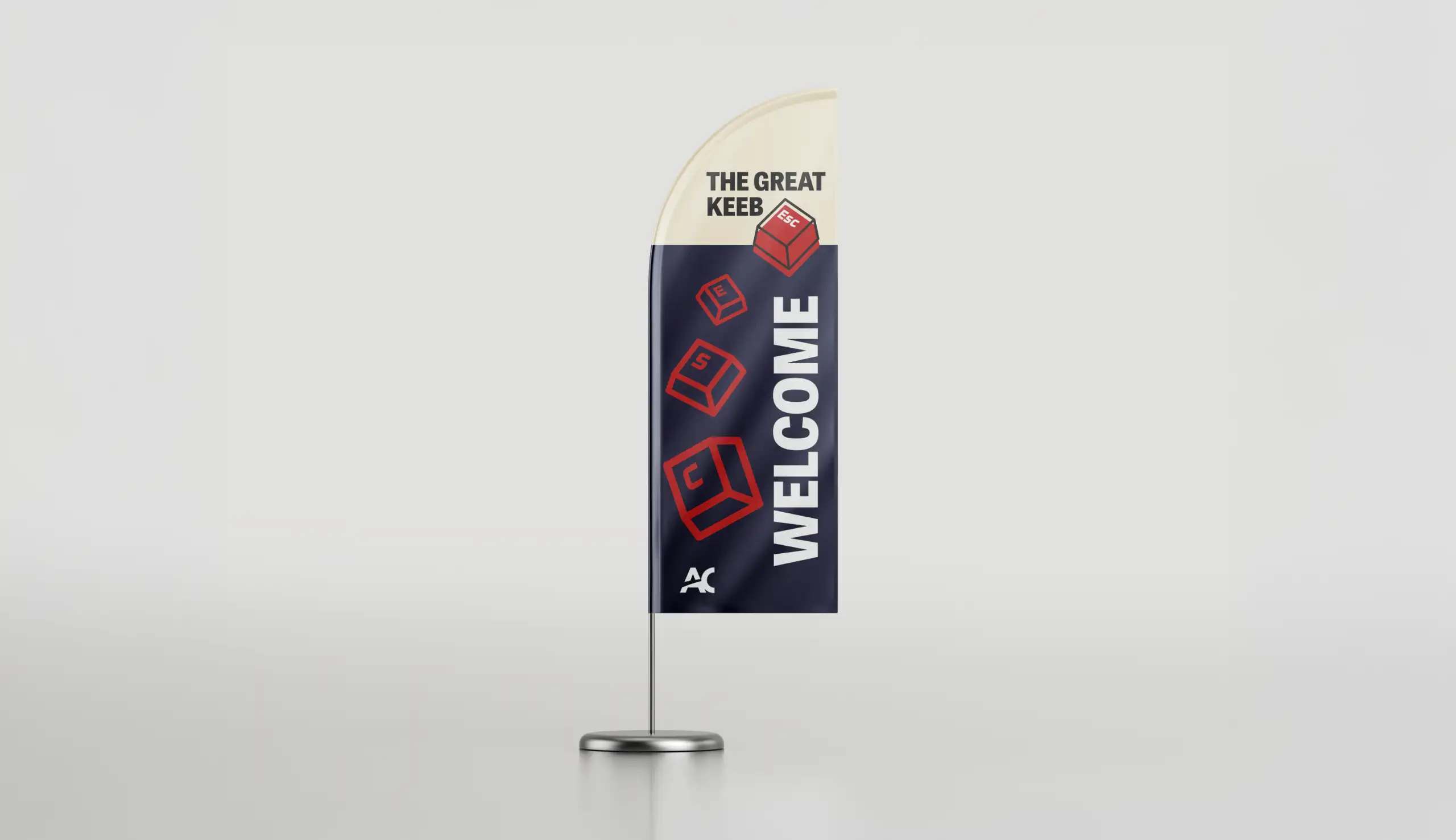 Feather banner with cream and navy blue background, featuring the text 'THE GREAT KEEB Escape' with red keyboard keys and vertical word 'WELCOME'.