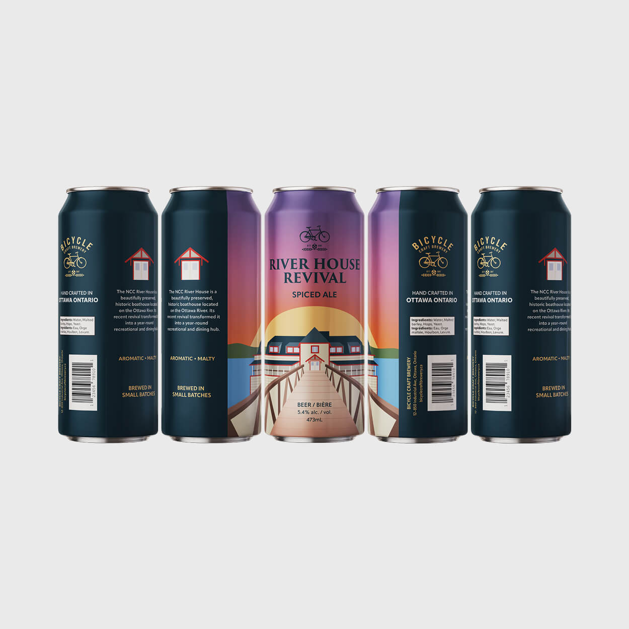 Five cans of Bicycle Craft Brewery’s River House Revival Spiced Ale arranged to show front and side labels featuring a boathouse illustration and product details.