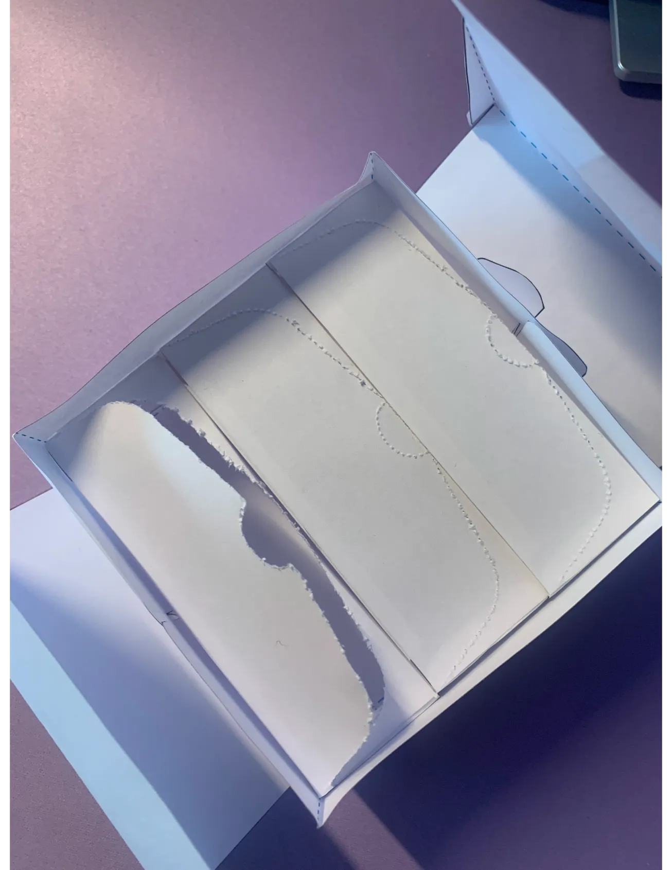 Showing an opened view of the prototype fully put together for a paper mockup