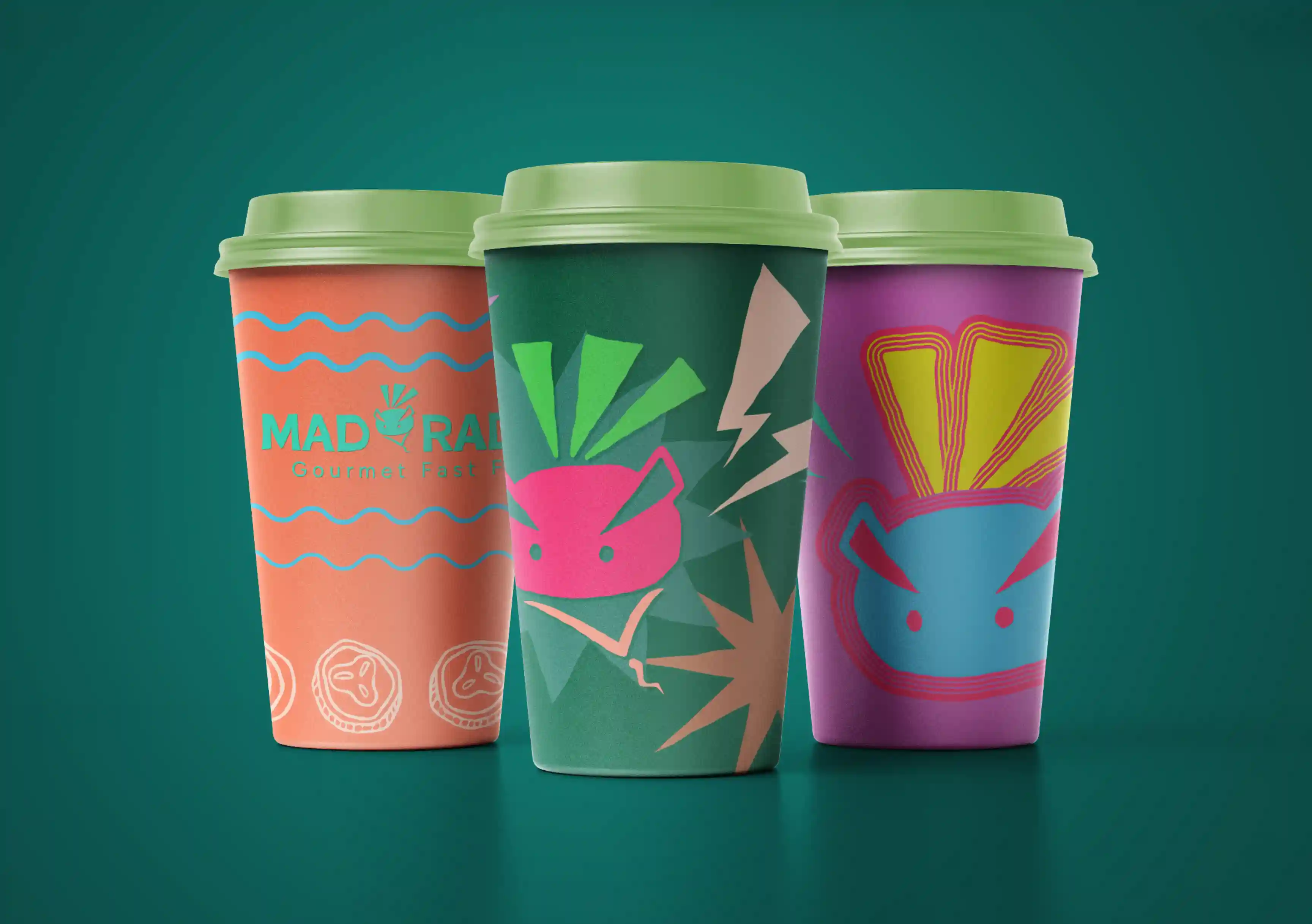 A mockup showcasing the three rebranded Mad Radish coffee cup design variations.