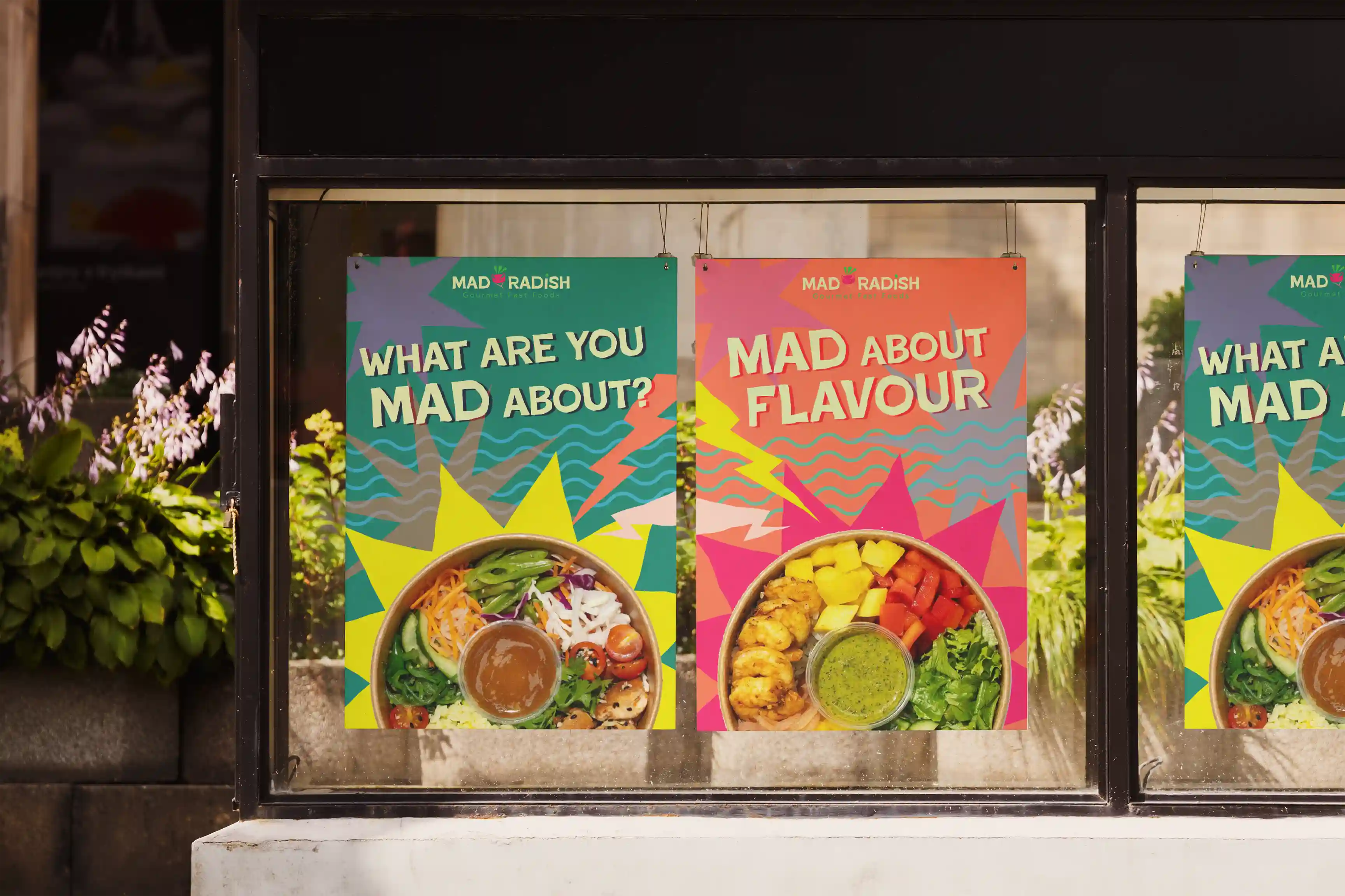 A mockup showcasing 2 different rebranded Mad Radish posters.