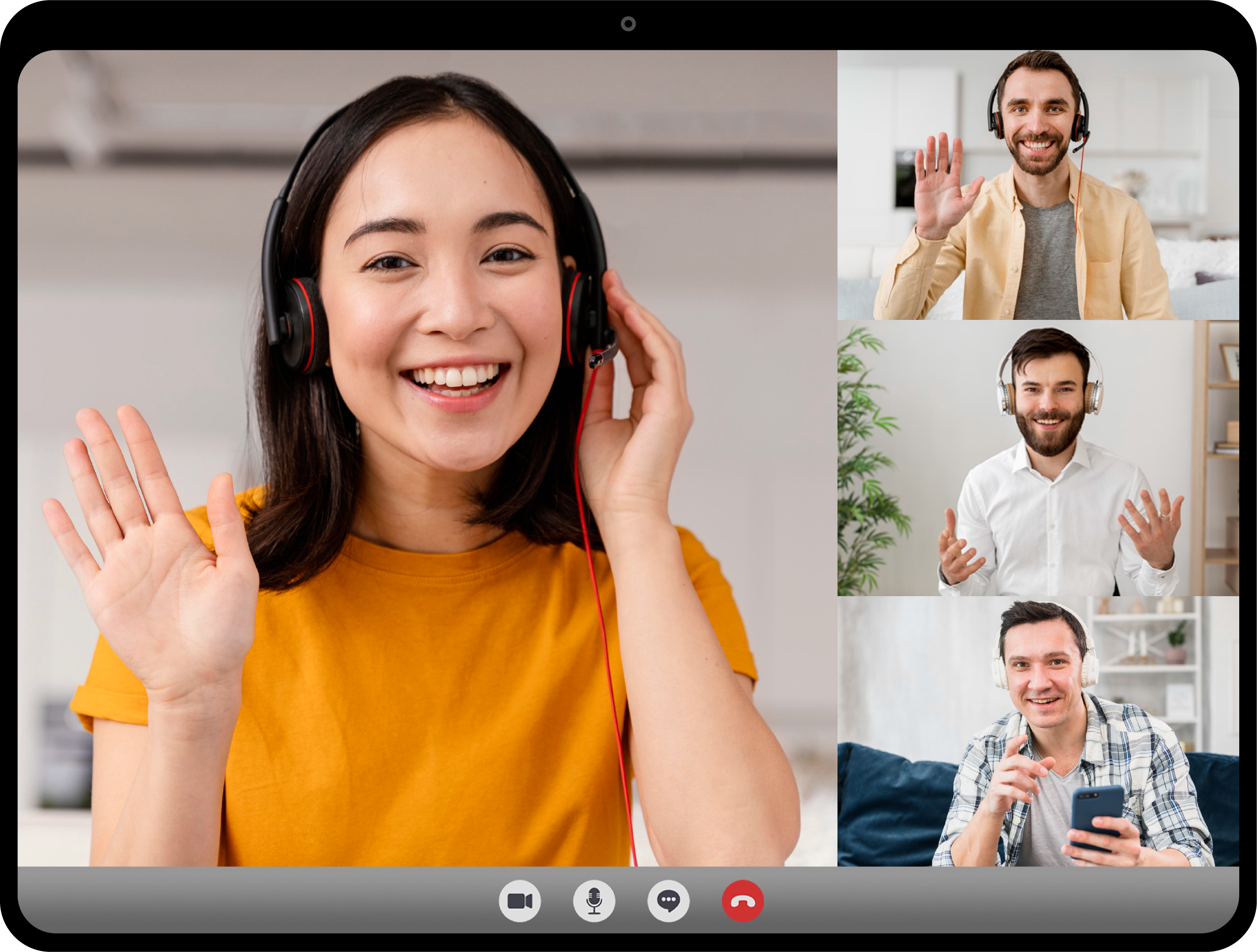 Four people in a video conference call, smiling and waving, all wearing headsets.