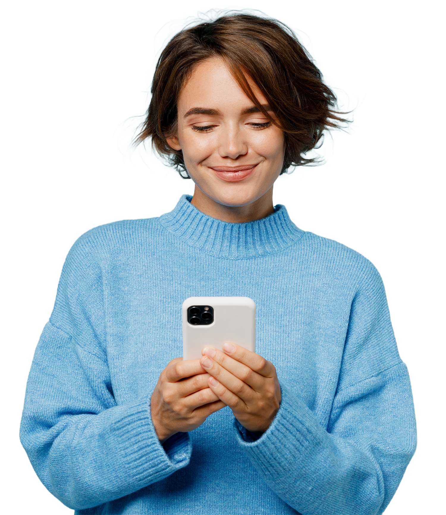 Smiling woman in blue sweater looking at and holding a smartphone.
