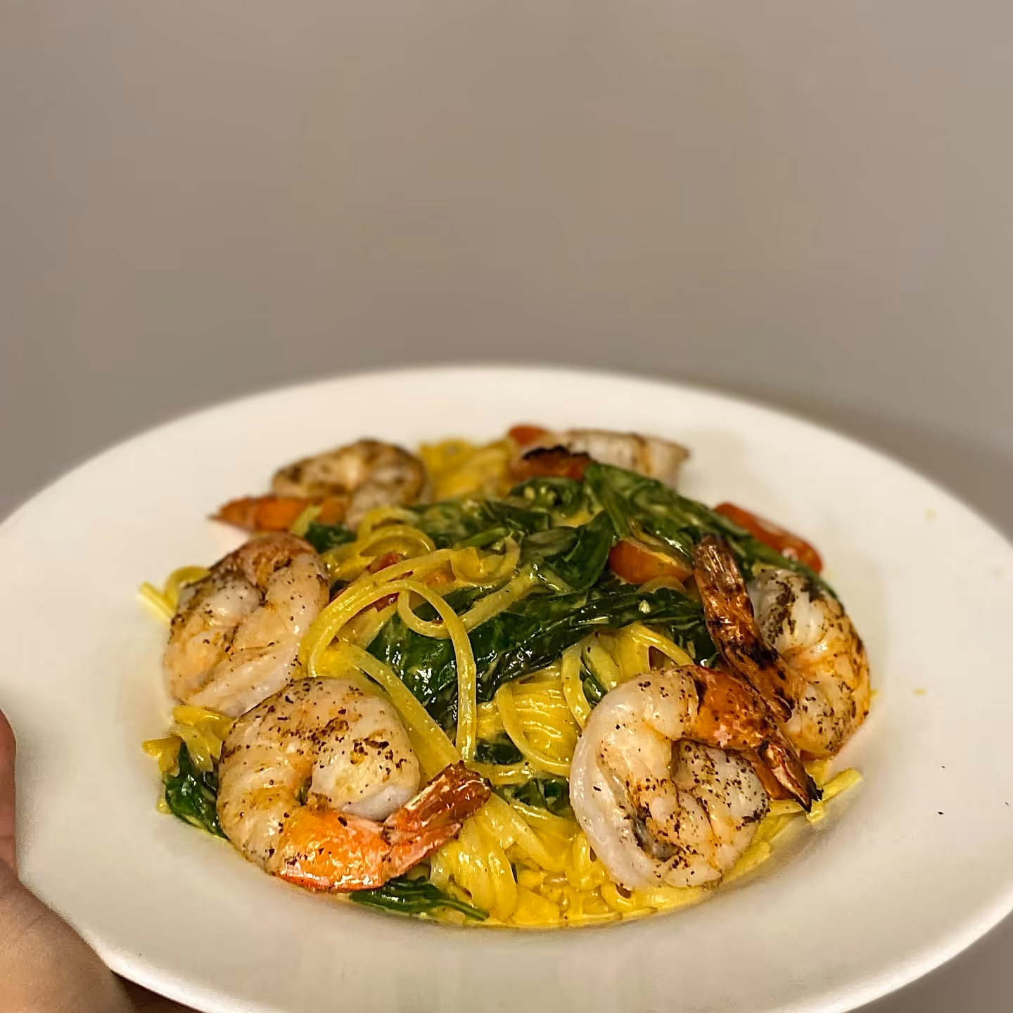 Mustard Linguini Special with sautéed shrimp, fresh tomatoes, and spinach.