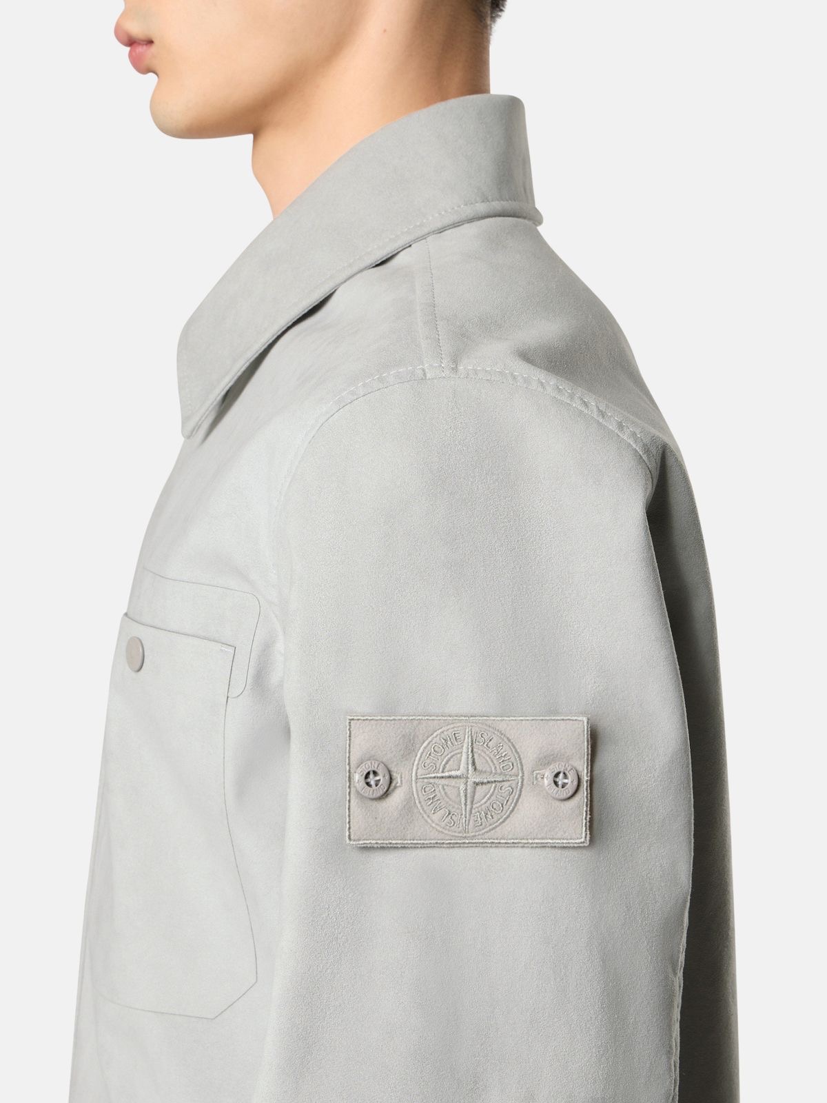 Caption: The badge remained. Only its contrast disappeared. Image Credit: Stone Island Ghost Pieces, monochrome compass badge across brushed cotton, David-TC, knitwear and Alcantara constructions. Courtesy Stone Island.