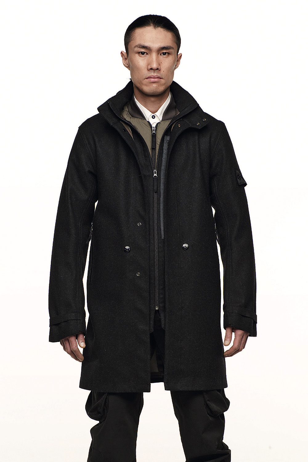Completion moved inside a system designed to be refilled. Image Credit: Stone Island Shadow Project, Look 1, ’009–’010. Stealth Coat 7WZ9 (PROOF), Zip Shirt 1YZ8 (SKIN), Cargo Pant 3WZ1 (RESIST), Web Belt, Bagjack® Bag (EQUIP). Courtesy Stone Island.